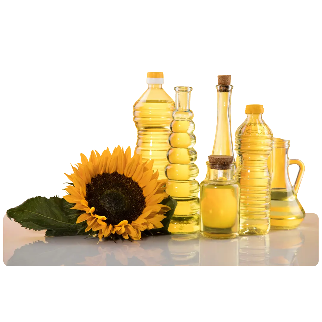 A collection of sunflower oil bottles, seeds, and a small bowl of sunflower seeds displayed on a wooden surface.